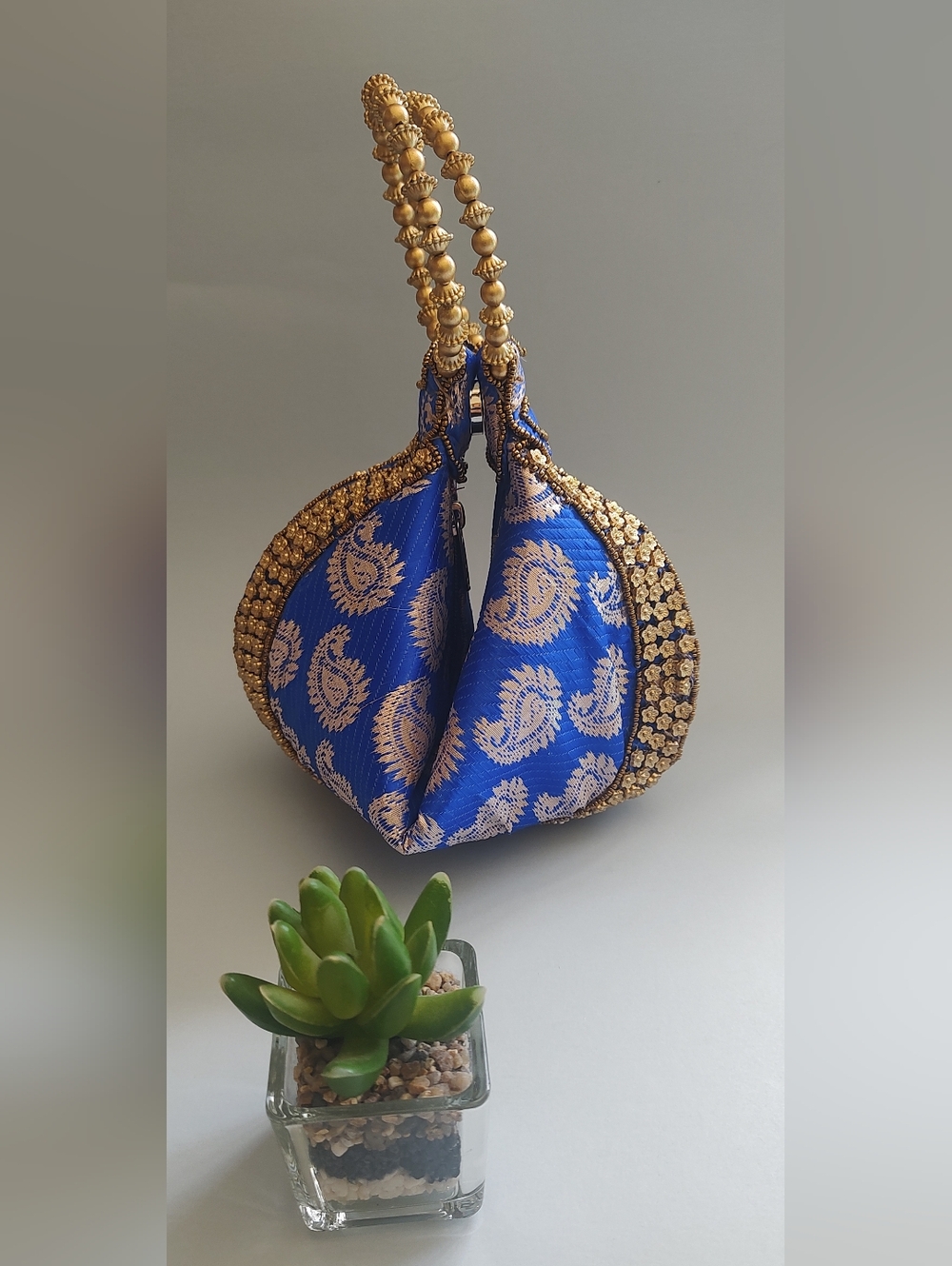 Blue Paisley Embellished Potli Clutch with Gold Handle